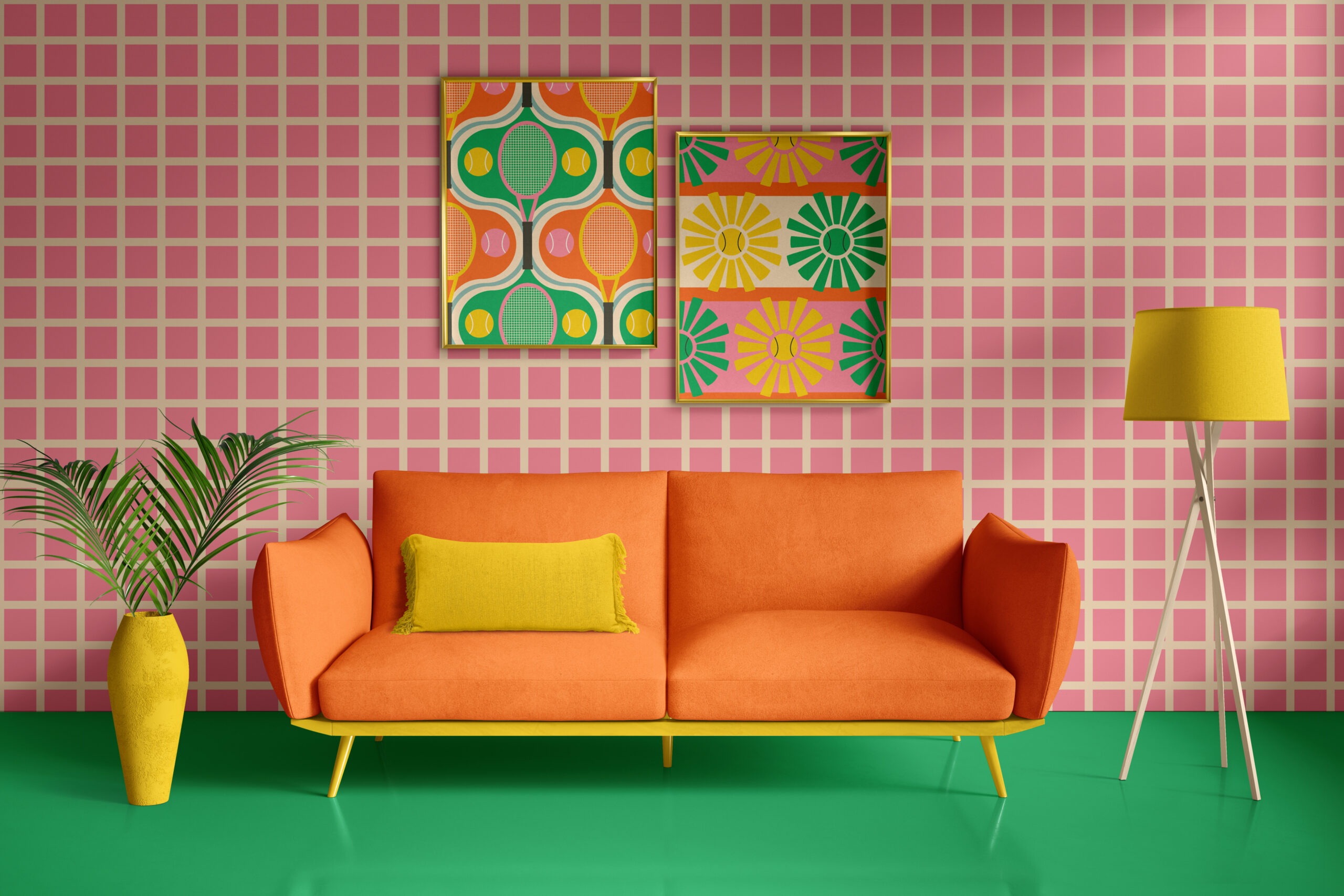 Living room with a bold retro grass green flora and a wall decorated with soft pink and beige white grid wallpaper. In the middle you see a bold retro 1970s orange and yellow sofa, accompanied by a yellow floor lamp and a flower vase with a green leaf in it.
On the wall there are two picture frames with wallpaper in it . One has a bold retro orange, grass green and yellow pattern with tennis clubs and balls. The other pattern features abstract green and yellow suns with tennis balls on a pink white horizontally striped background.