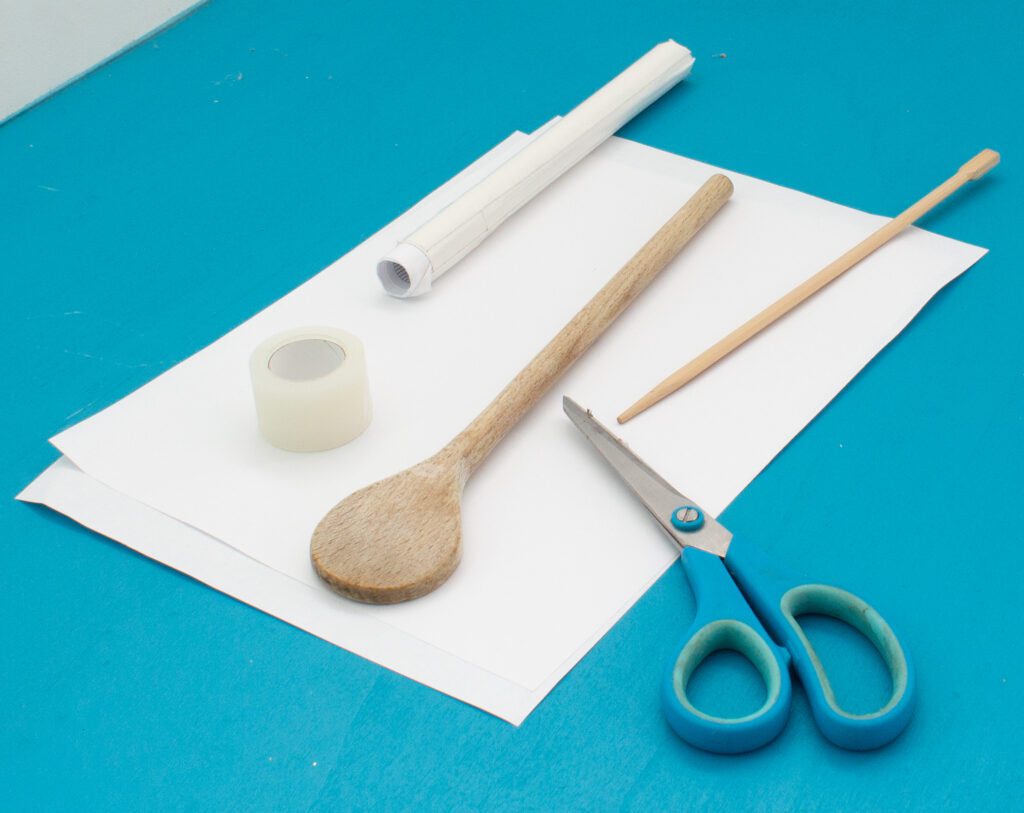 Material needed to turn small parts of stuffed animals: wooden spoon, 2 sheets of US letter size or A4 paper, chopstick, scissors, adhesive tape