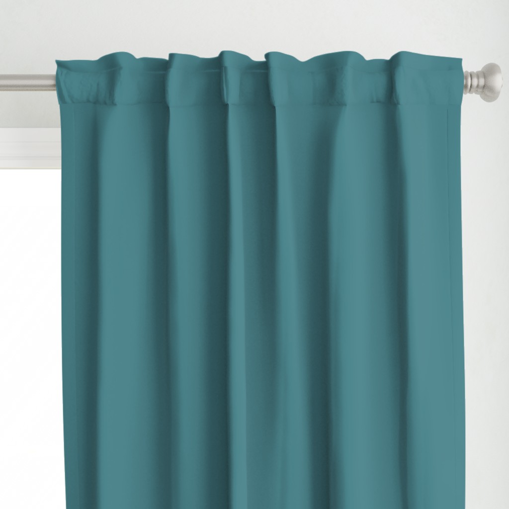 Matching solid teal blue curtains
