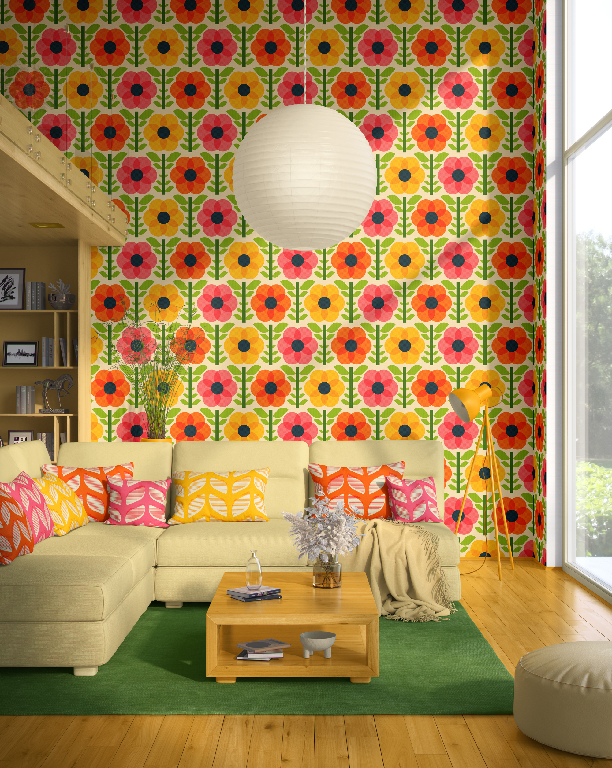 Peel and stick wallpaper in a mid-century modern living room featuring a bold geometric floral pattern in pink, yellow, orange, and green. The room includes a bright green sectional couch, colorful leaf-patterned pillows, a wooden coffee table, and a yellow floor lamp with a large white paper lantern pendant light.