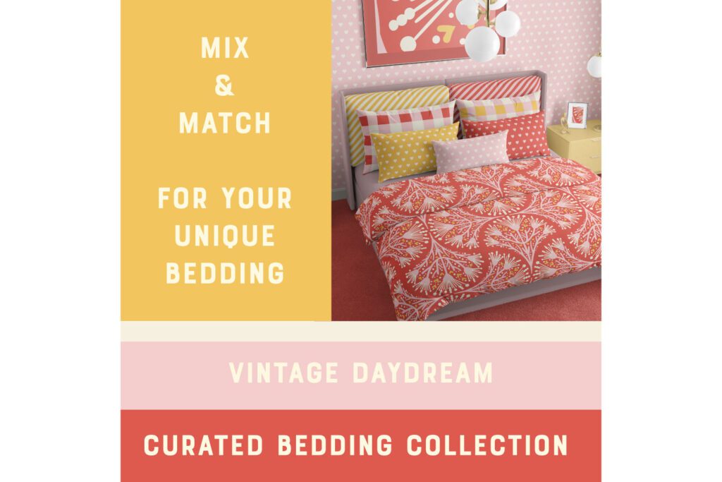 Vintage-inspired wallpaper with small white hearts on soft pink pattern shown in a bedroom setting featuring a bed with mix-and-match patterned pillows and a floral duvet cover; yellow side table and modern pendant lights complete the cozy, retro style room.