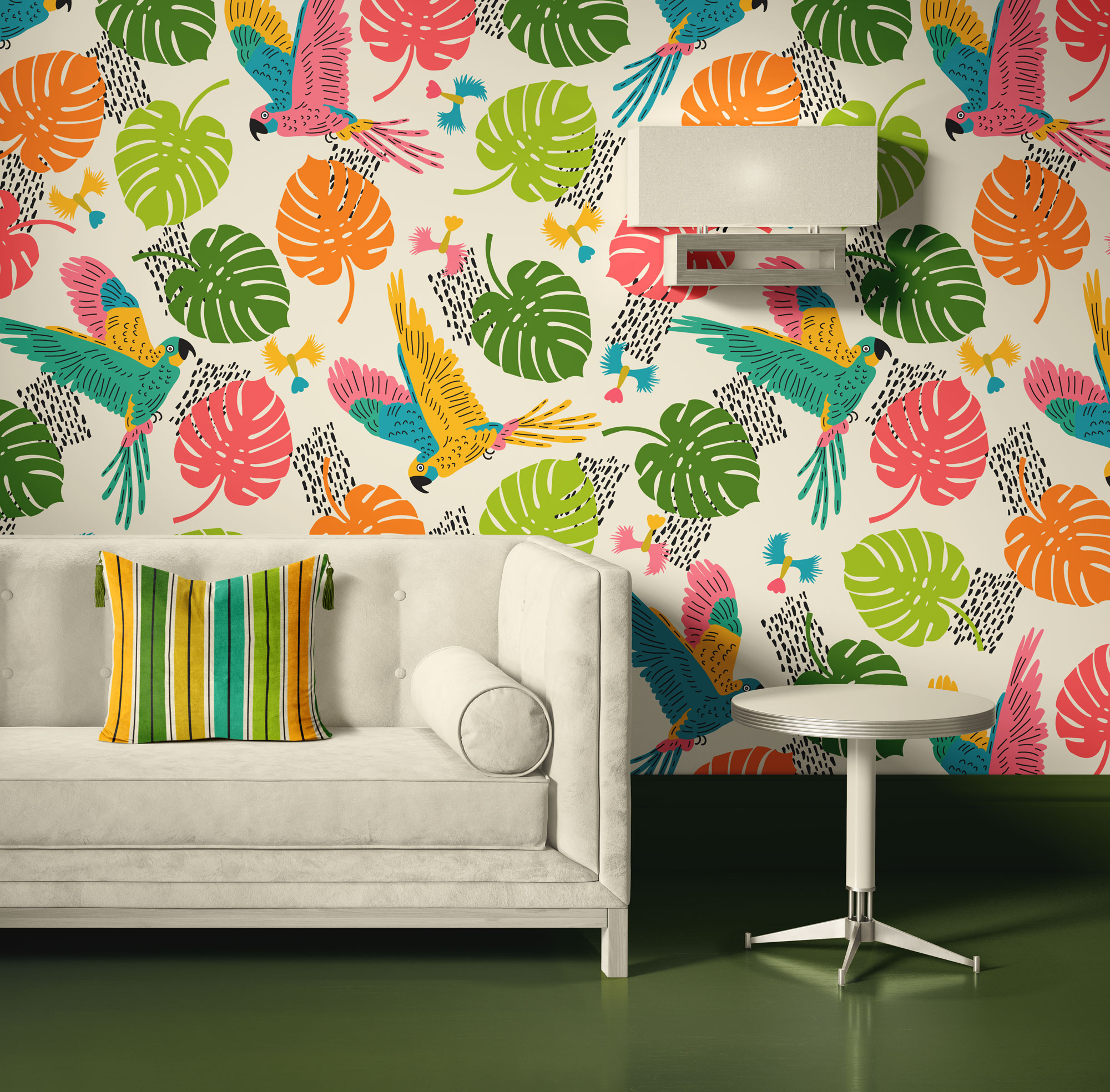Living-room-with-sofa---joyful-jungle---parrots-in-happy-retro-colours-stripes-M Peel and stick wallpaper featuring a tropical pattern of colorful parrots and large tropical leaves in bright retro colors on a light background, styled in a living room with a light beige sofa, a vibrant striped pillow, a small round white side table, and a modern wall lamp.