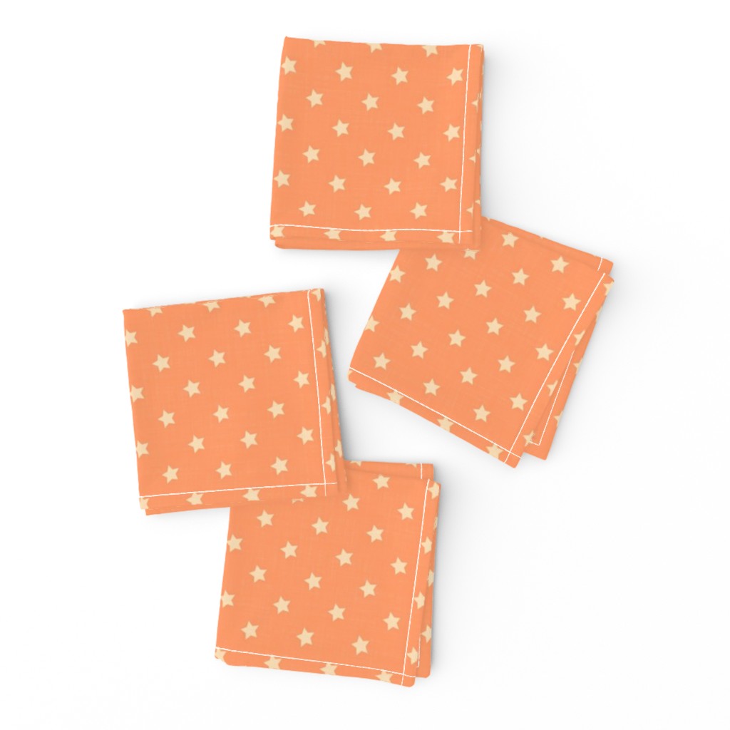 Napkins featuring a structured repeat of tiny beige stars on an atomic tangerine orange background. The design reflects a 1950s retro graphic style with playful, rhythmic star shapes. The image shows the napkins neatly folded with no visible furniture or decor.