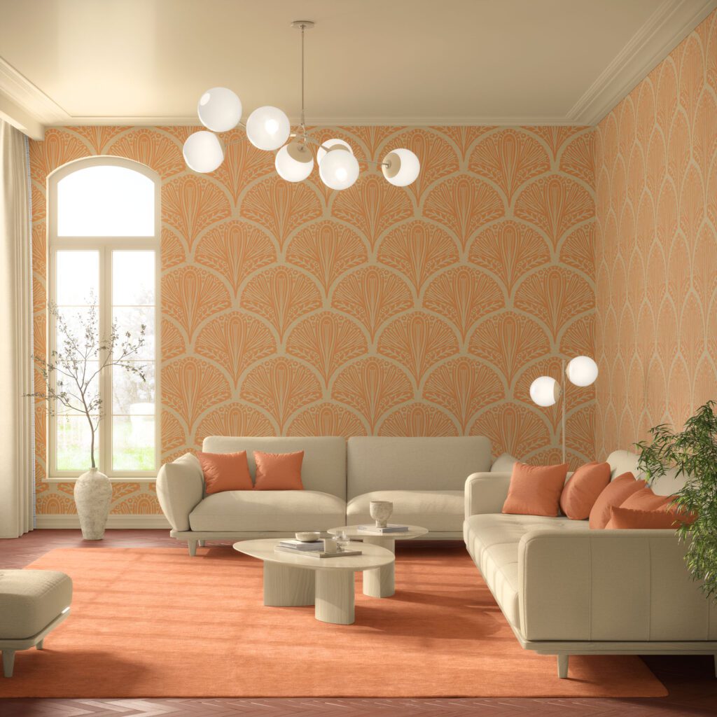 Peel and stick wallpaper in warm apricot orange and cream featuring a large-scale Art Deco style floral pattern decorating a modern minimalist living room with beige sofas, apricot throw pillows, cream tables, and a modern white globe chandelier.